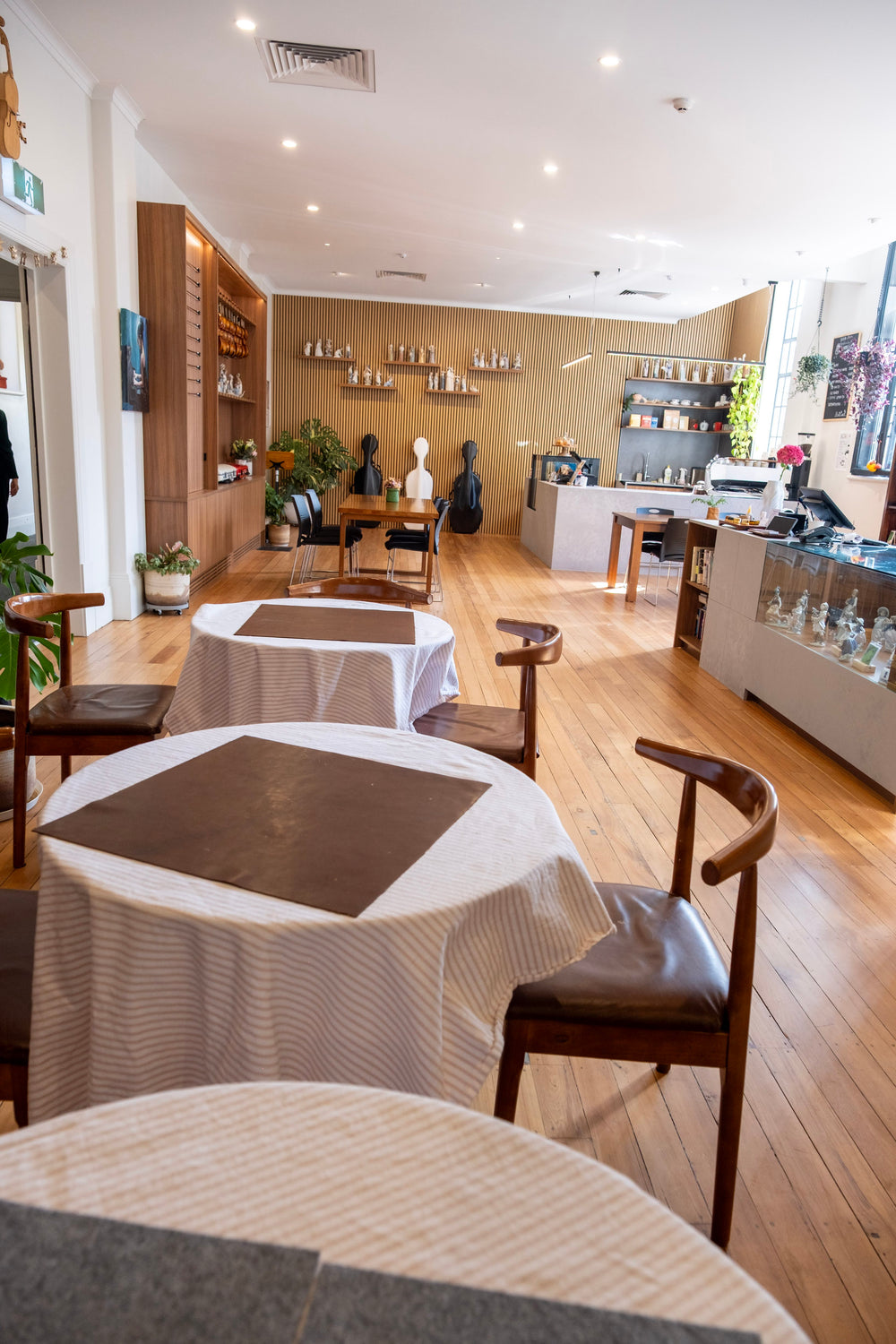 Round tables arranged for a gathering at Symphonia Café