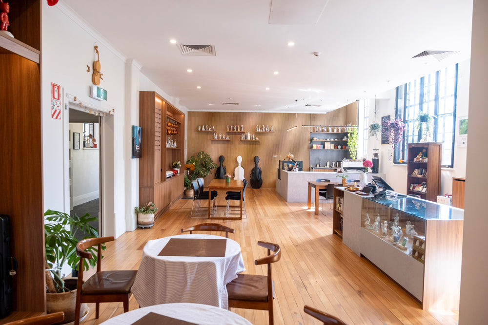Tables and counter in the bright Symphonia Café interior
