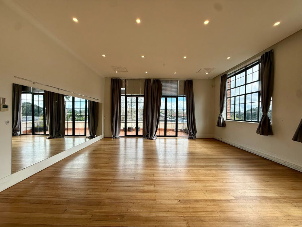 Symphonia Hall open floor with mirrored wall and terrace doors