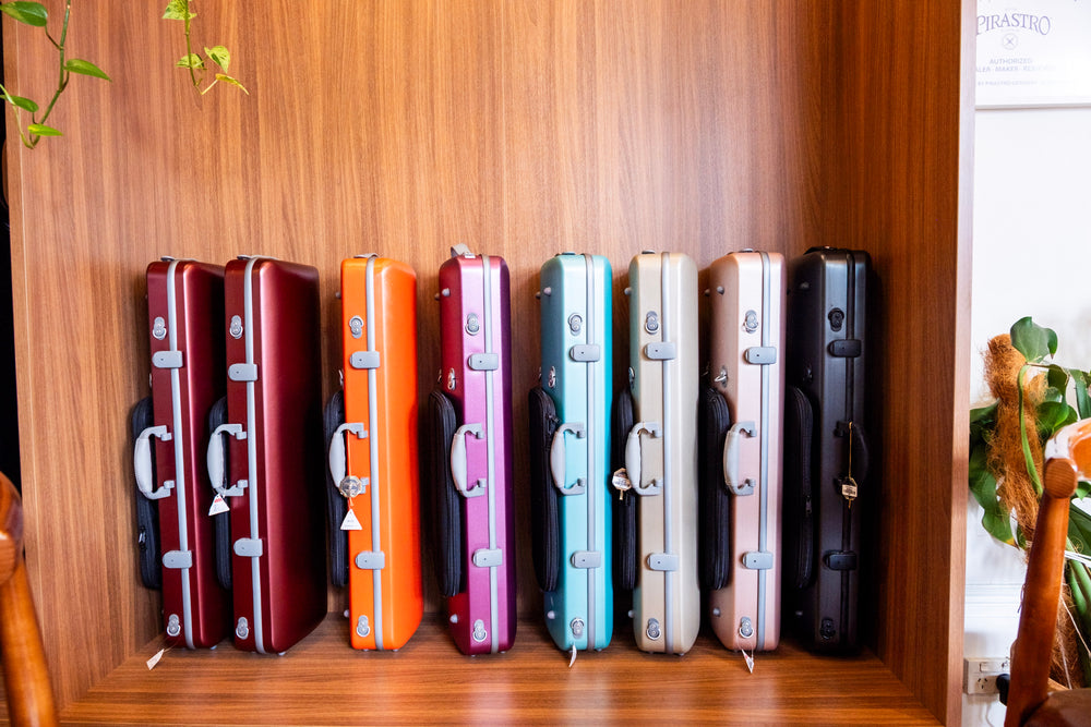 Colourful violin cases displayed at Symphonia Strings