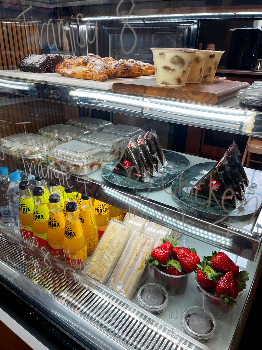 Cakes, desserts and drinks in the café display cabinet
